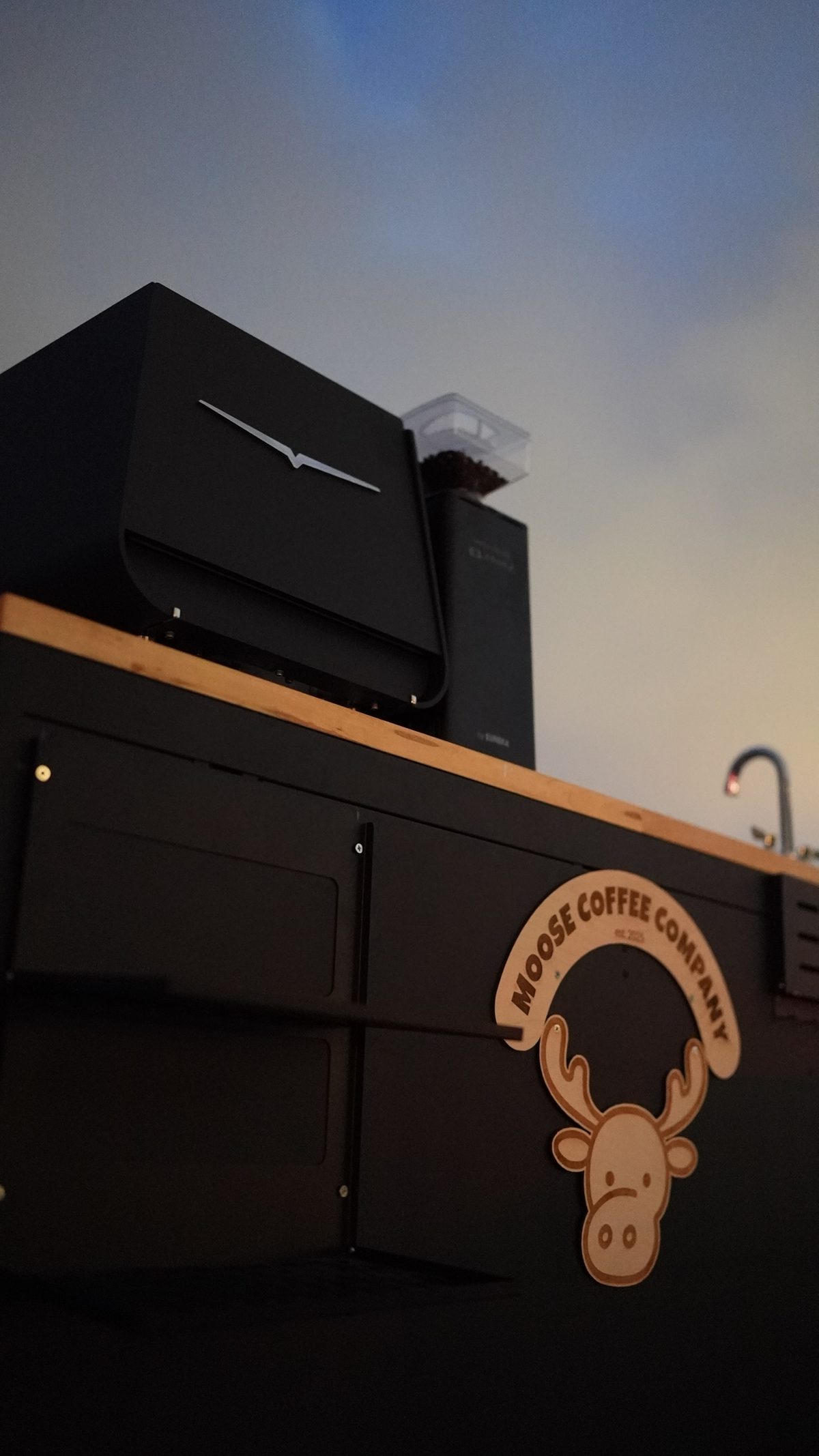Moose Coffee Company cart with branded logo panel